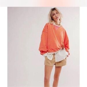 Free People Striped Camden Sweatshirt in pink and orange.